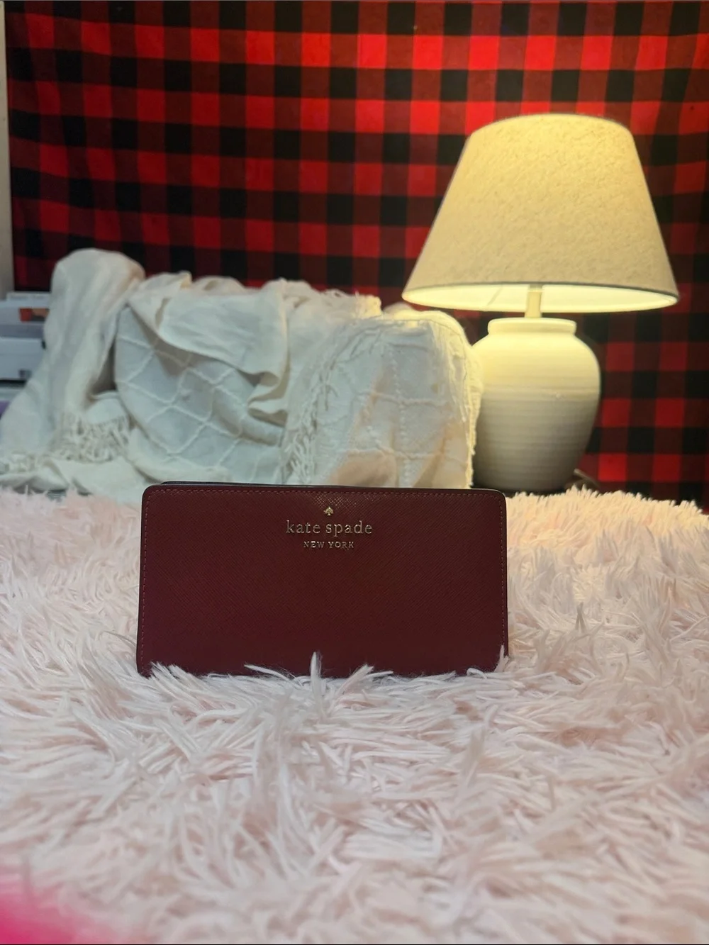 kate spade burgundy saffiano leather zip wallet with gold logo